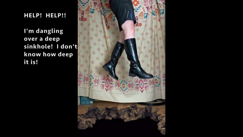 4K: Tall leather boots dangle over collapsed sinkhole by ratchet strap, which slowly starts fraying